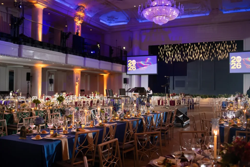 Elegant corporate event staging and lighting setup in a ballroom prepared for a large-scale event production