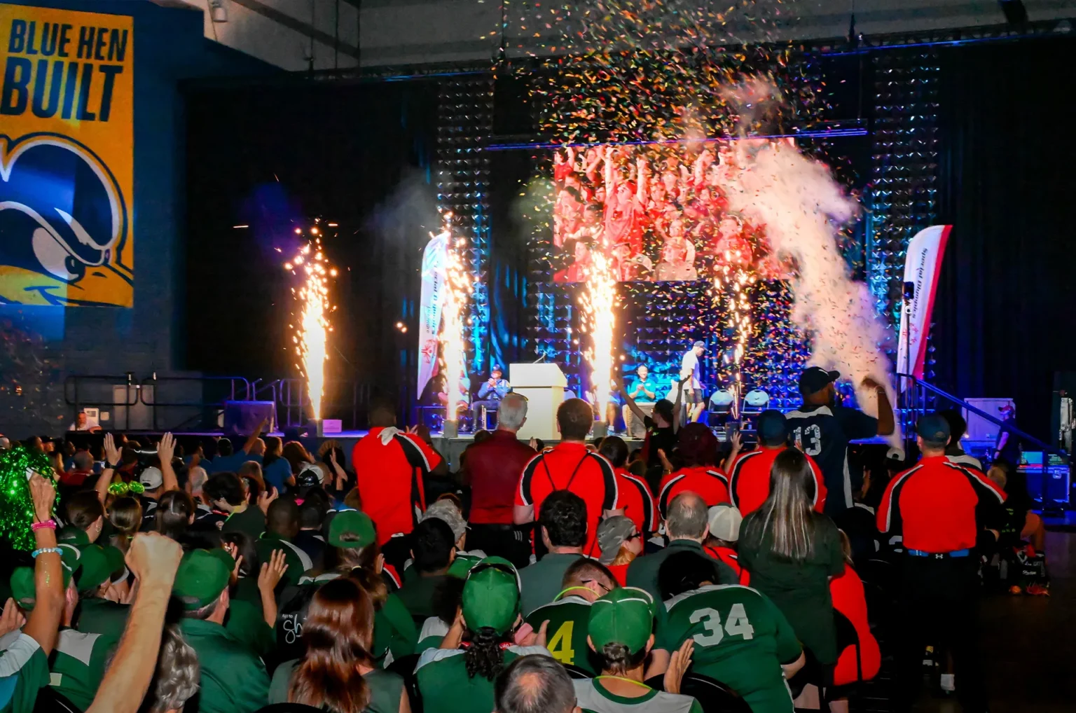 Confetti and stage effects celebrate the Special Olympics Delaware Summer Games Opening Ceremonies as athletes and spectators cheer.