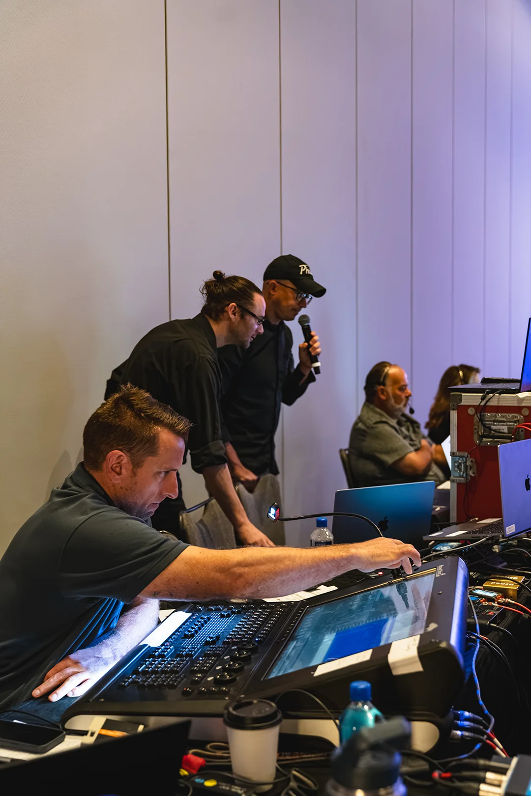 Showorks AV technicians manage a live event console, showcasing an AV production company Philadelphia.
